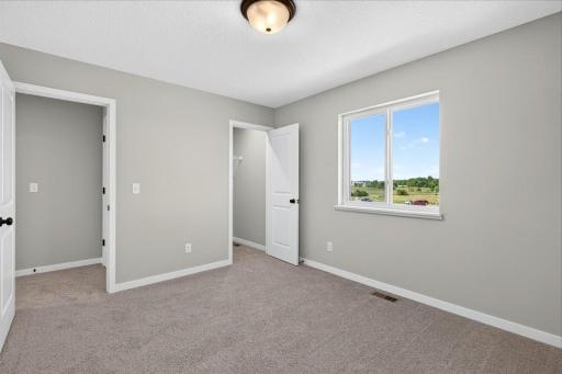 PHOTO OF A DIFFERENT HOME WITH SIMILAR PLAN AND FINISHES. Bedroom 4.
