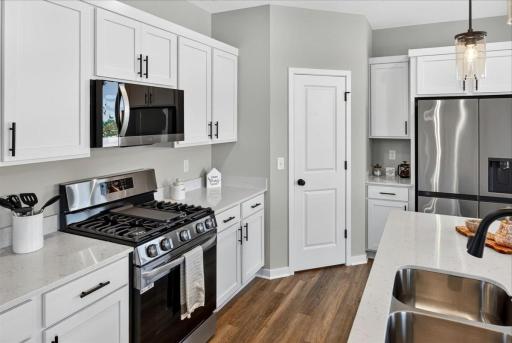 PHOTO OF A DIFFERENT HOME WITH SIMILAR PLAN AND FINISHES.