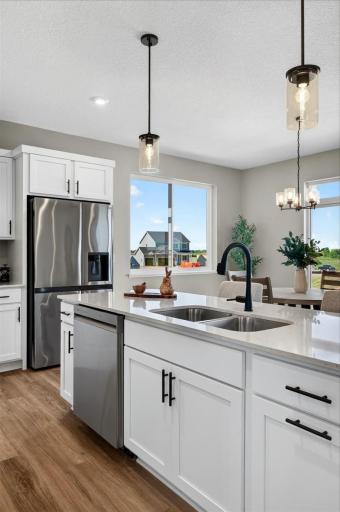 PHOTO OF A DIFFERENT HOME WITH SIMILAR PLAN AND FINISHES.