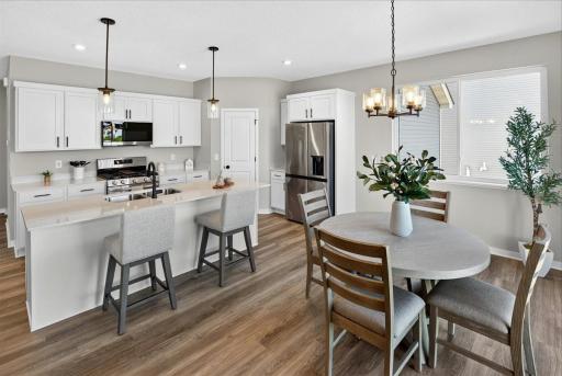 PHOTO OF A DIFFERENT HOME WITH SIMILAR PLAN AND FINISHES.