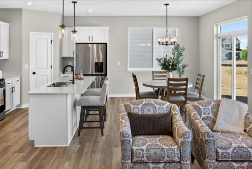 PHOTO OF A DIFFERENT HOME WITH SIMILAR PLAN AND FINISHES.