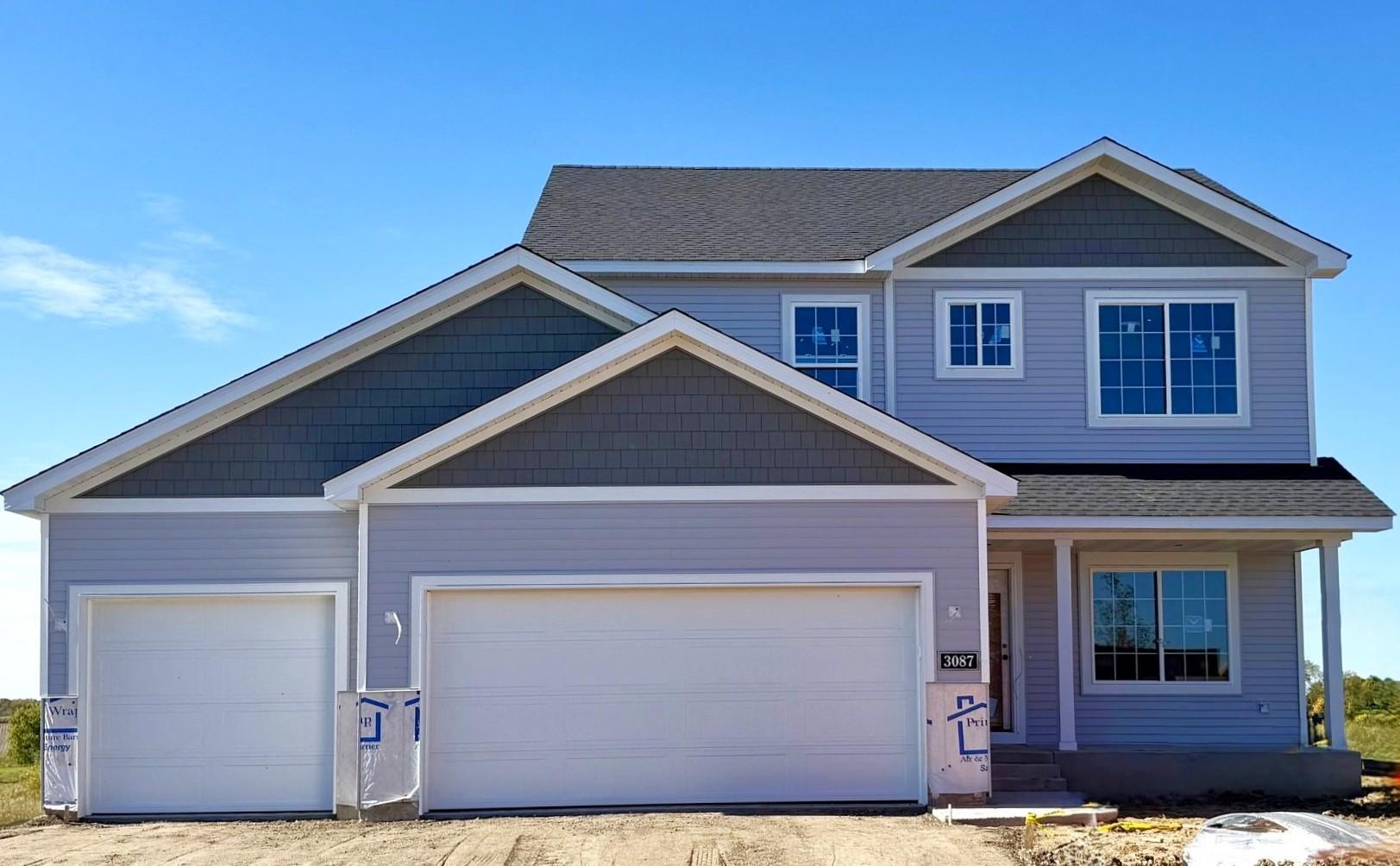 3087 Jandura Ave NE- New Construction Home will be ready for a November move-in! Stone accents and driveway will be installed soon. Highlights include a 4 Bay Garage located on a Walkout Homesite!