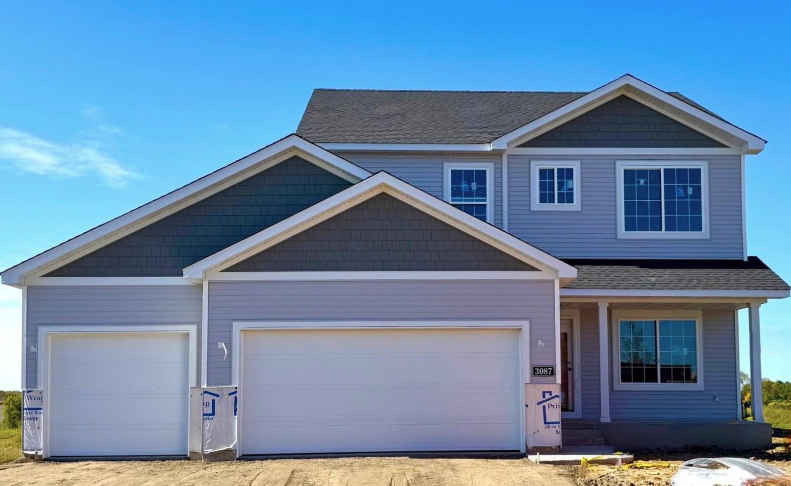 3087 Jandura Ave NE- New Construction Home will be ready for a November move-in. Highlights include a 4 Bay Garage located on a Walkout Homesite! Sod, Irrigation System, and Front Plantings included. Stone accents and driveway will be installed soon.
