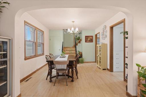 The spacious dining room sits at the heart of the home with plenty of room to gather and a seamless connection to the living space.