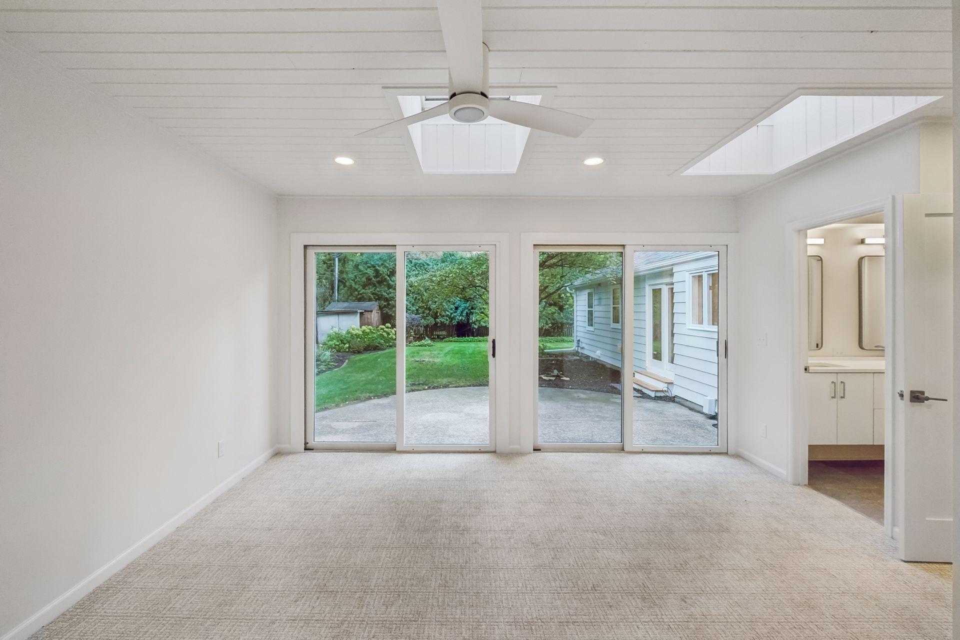 Primary suite accesses patio.