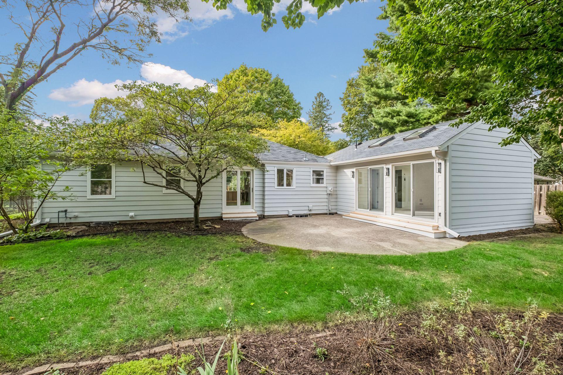 Backyard facing west has slider from kitchen and primary bedroom suite.