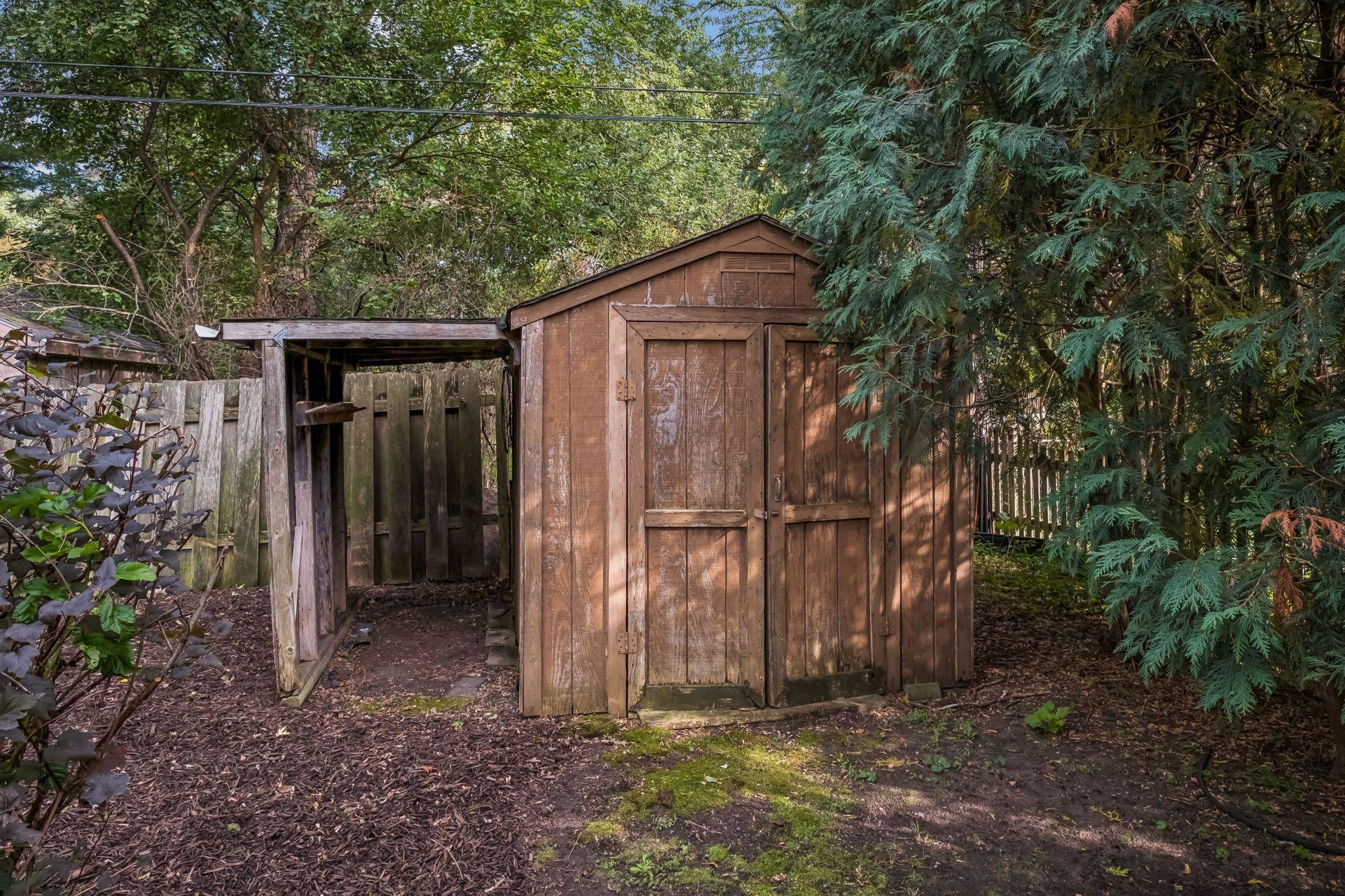 Storage shed, perfect for lawn mower, and gardening items.