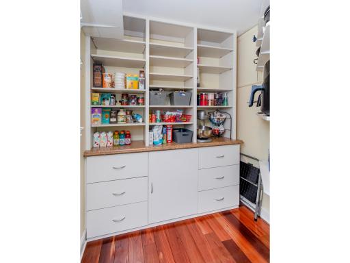 Large walk-in pantry provides extra storage for added convenience.
