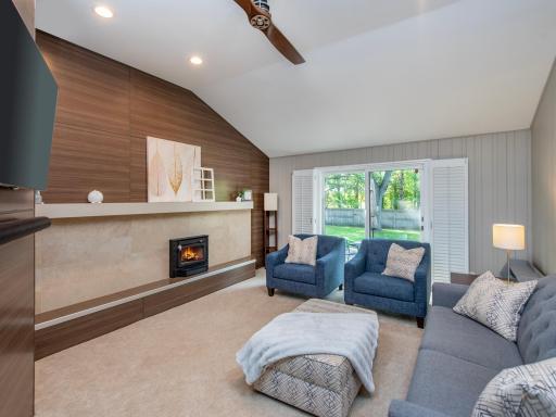 A vaulted ceiling, recessed lighting and easy access to the backyard create a bright, open living area filled with natural light.
