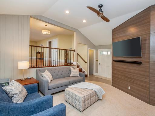 The open-concept living room flows seamlessly into the main level, creating a spacious and connected living area.