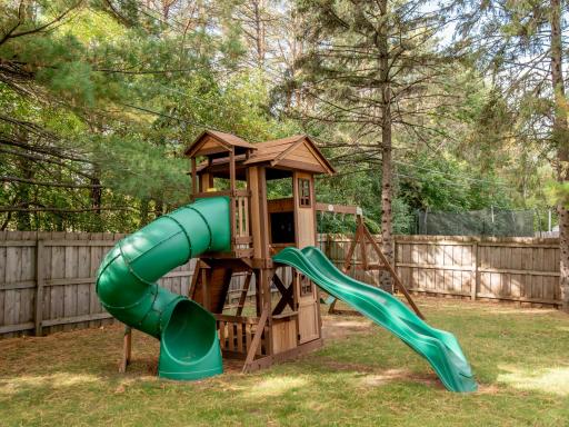 The backyard playground stays with the home, ready for endless hours of outdoor fun.