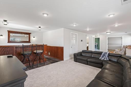 Lower level family room, bar, game area, three quarter tile bath, storage & laundry/mechanical. 2022 carpet