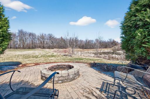 njoy the built-in firepit with pond views!