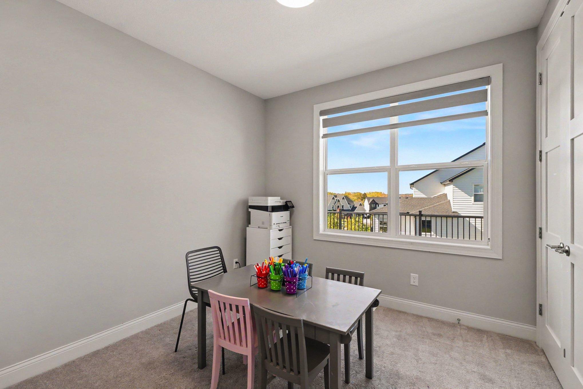 Main-level bedroom, office, or playroom.