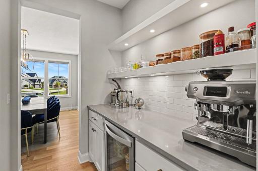 Butler walk-through and walk-in pantry off the formal dining room and kitchen.