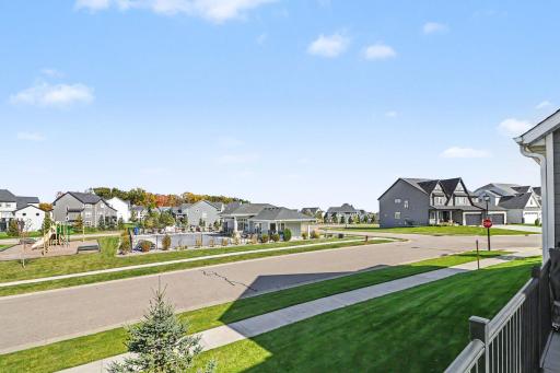 View from the deck of the community pool, playground, and clubhouse.