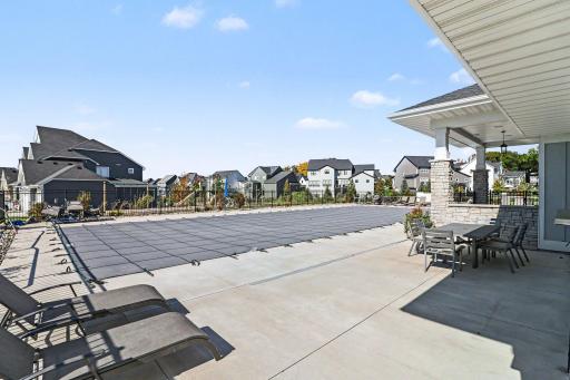 The neighborhood clubhouse and pool can be seen from the deck and patio