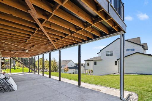This has an under-deck drainage system and an underground buried downspout system. Ask about the 3- or 4-season city-approved porch plans.
