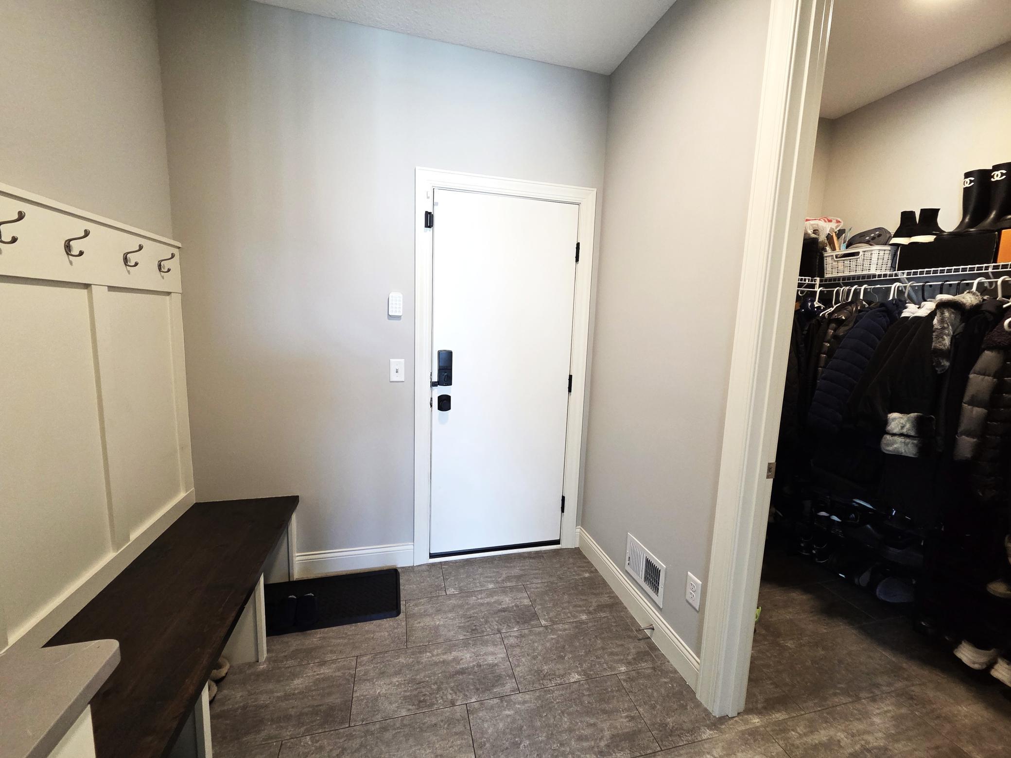 Mud room and family closet off the garage.