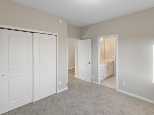 PHOTO OF A DIFFERENT HOME WITH SIMILAR PLAN. FINISHES MAY VARY. Bedroom 3.