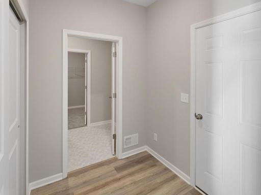 PHOTO OF A DIFFERENT HOME WITH SIMILAR PLAN. FINISHES MAY VARY. Mudroom.