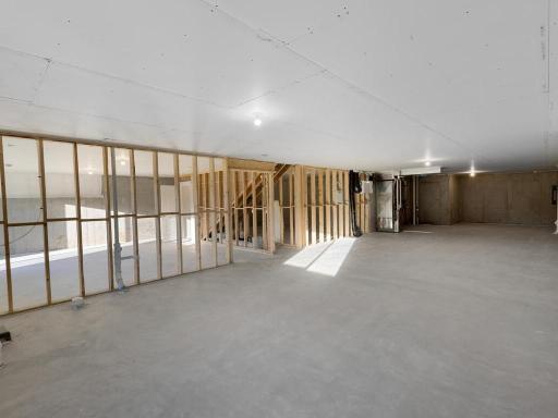 PHOTO OF A DIFFERENT HOME WITH SIMILAR PLAN. FINISHES MAY VARY. Unfinished Walkout Lower Level ready for future finish.