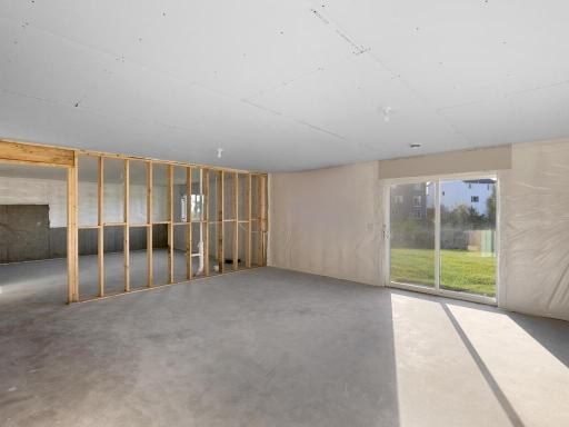 PHOTO OF A DIFFERENT HOME WITH SIMILAR PLAN. FINISHES MAY VARY. Unfinished Walkout Lower Level ready for future finish.