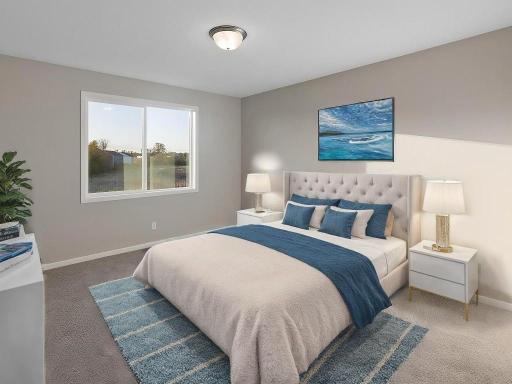 PHOTO OF A DIFFERENT HOME WITH SIMILAR PLAN VIRTUALLY STAGED. FINISHES MAY VARY. Primary Suite.