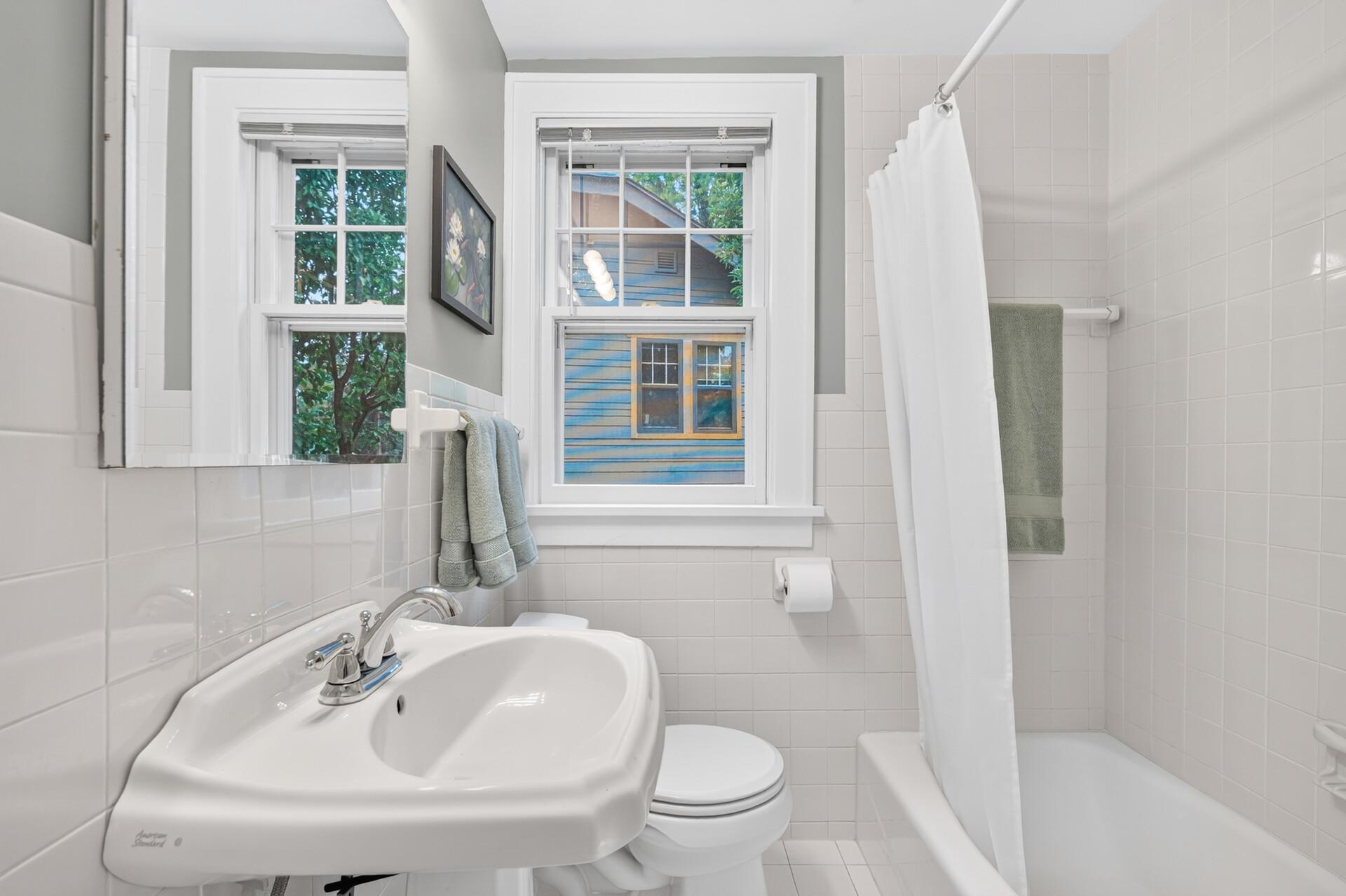 Main-level full bath with classic character.