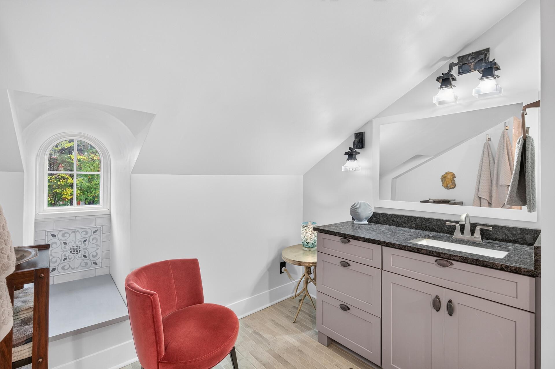 Beautifully designed primary bath completes the upper-level retreat.