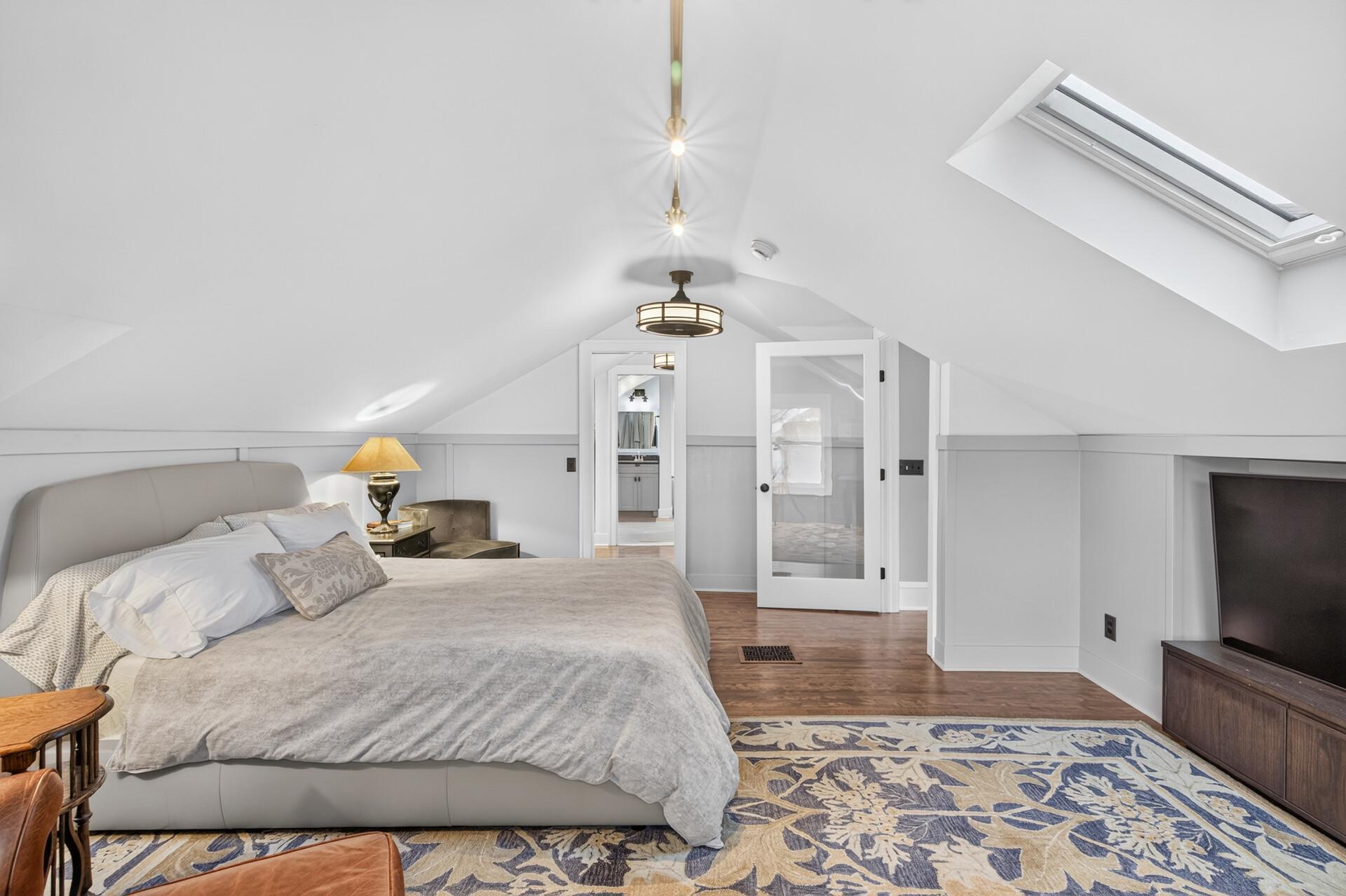 Another view of the peaceful and private primary bedroom.