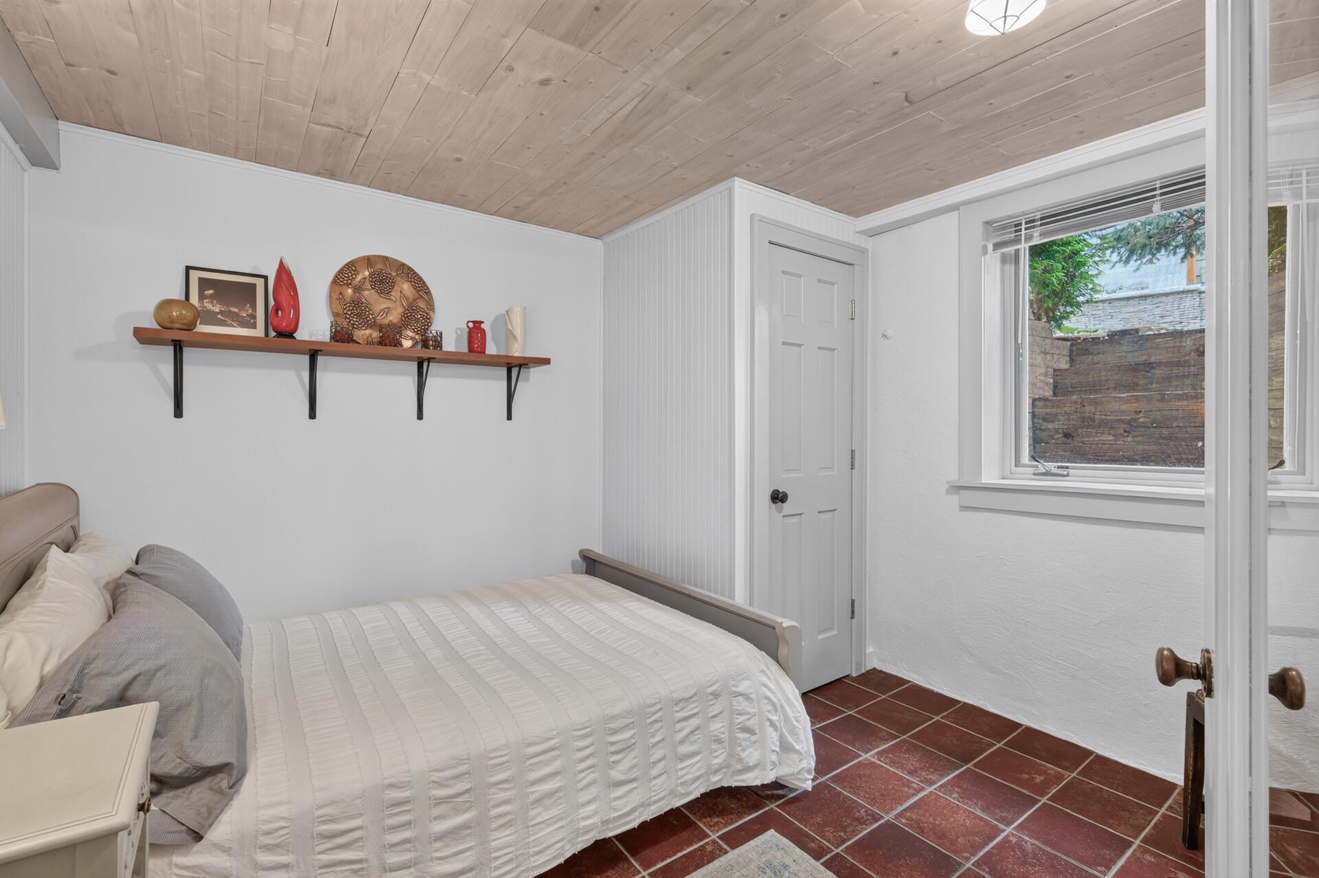 Second lower-level bedroom provides additional flexibility for guests or rental use.