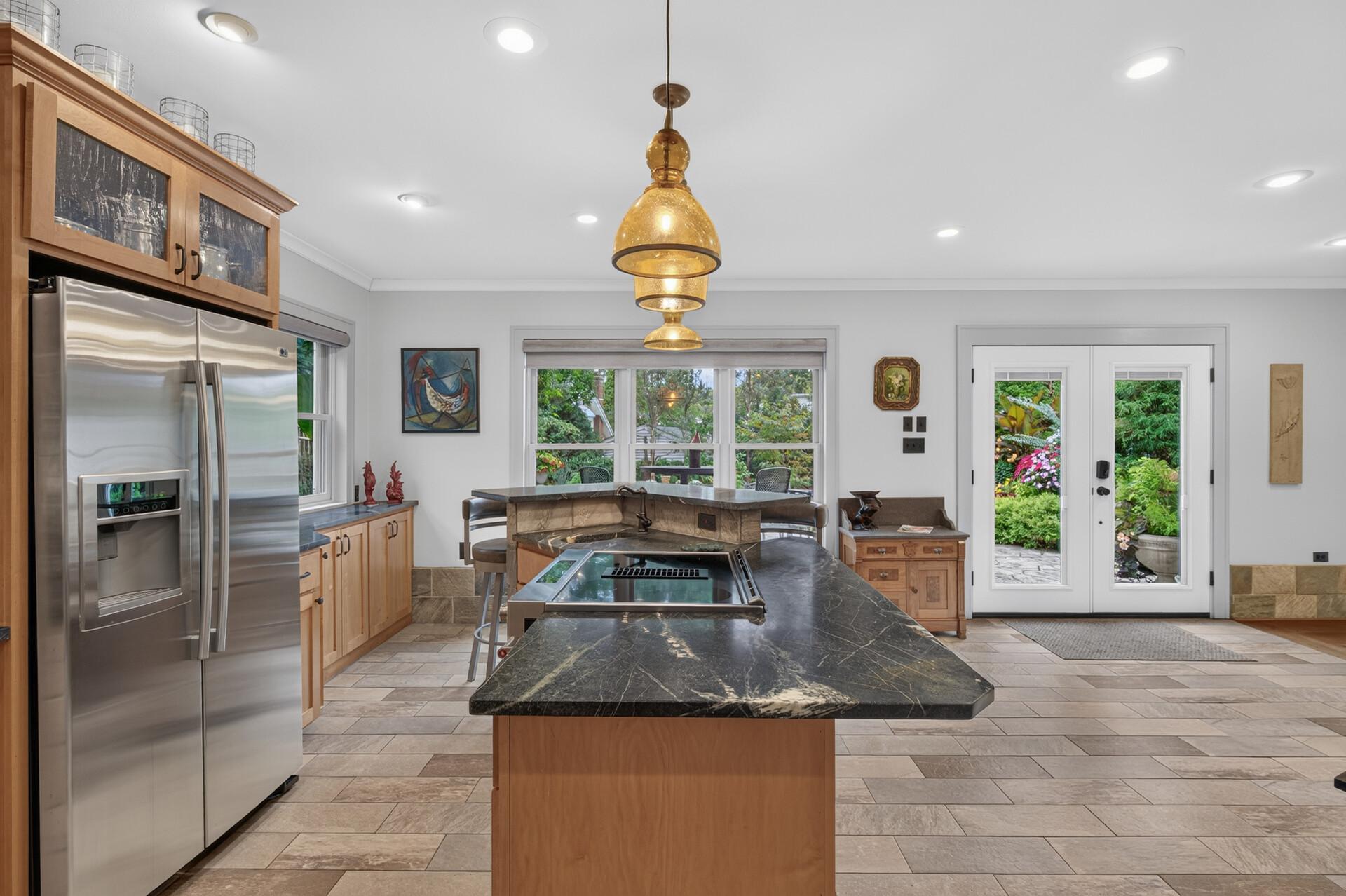 Another view of the spacious lower-level kitchen with a center island.
