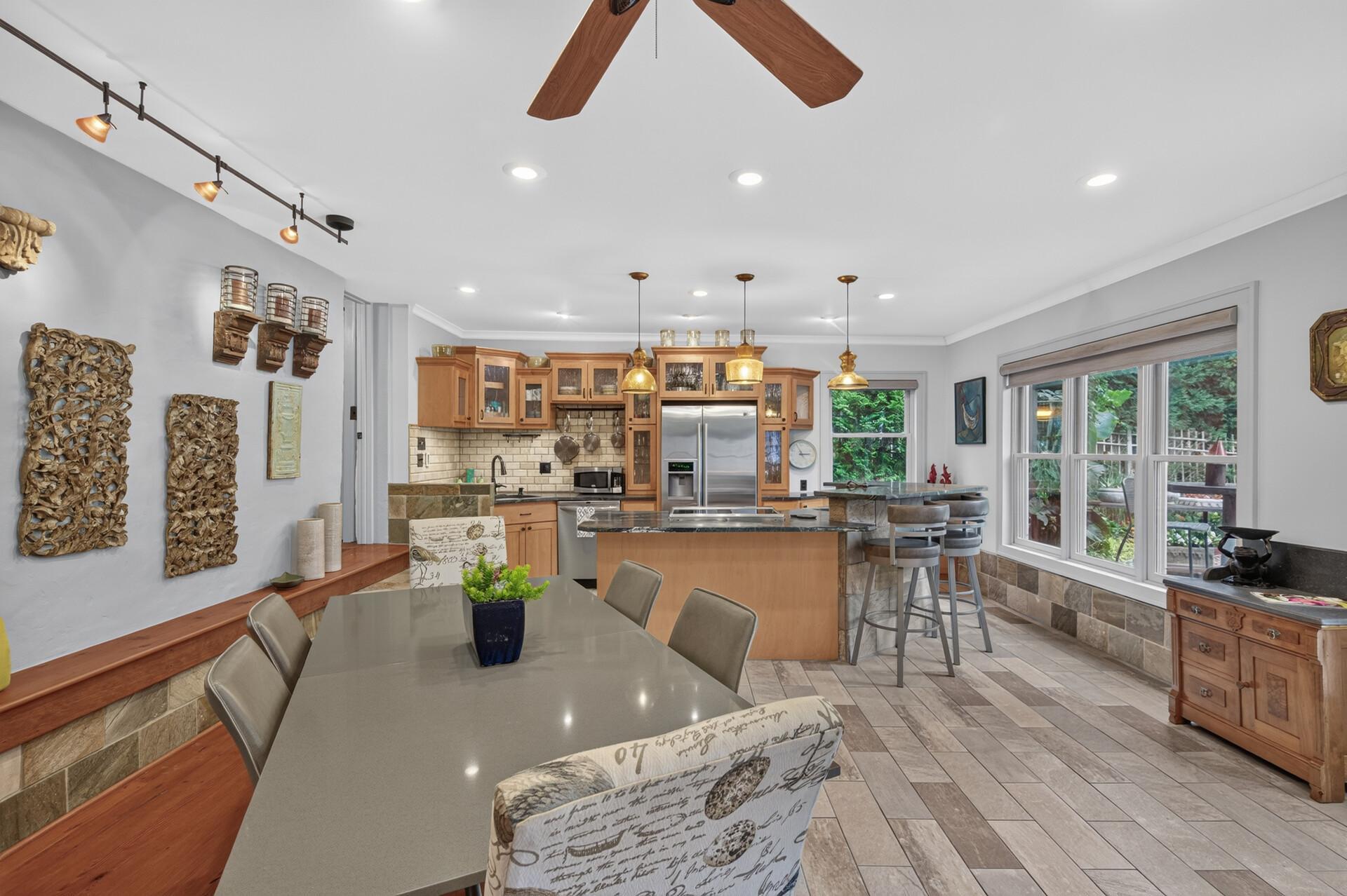 The lower level combines living, dining and kitchen areas in an exceptionally flexible layout.