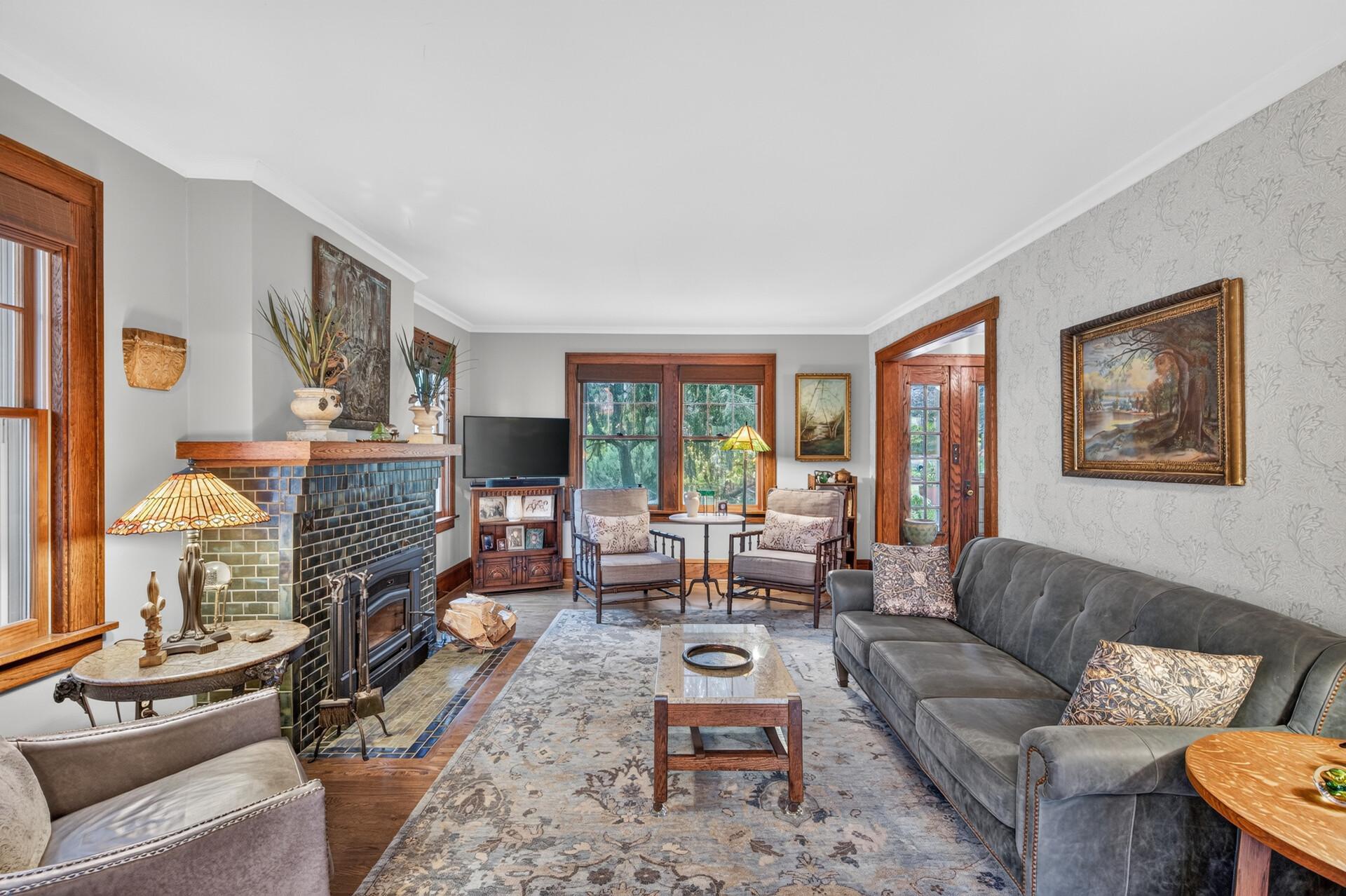 Light-filled living room with hardwood floors and beautiful architectural character.