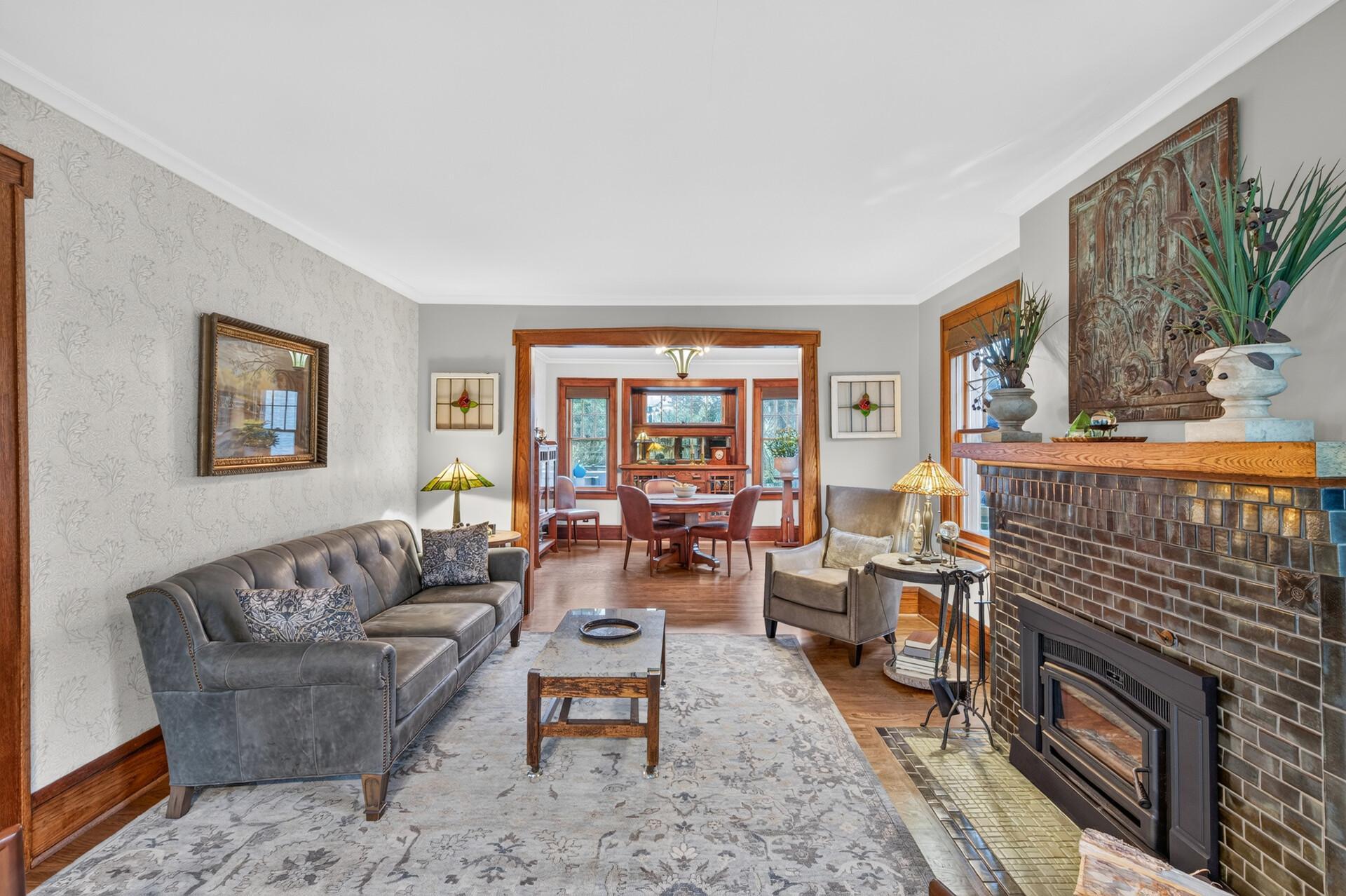 Inviting living room featuring a wood-burning fireplace insert.