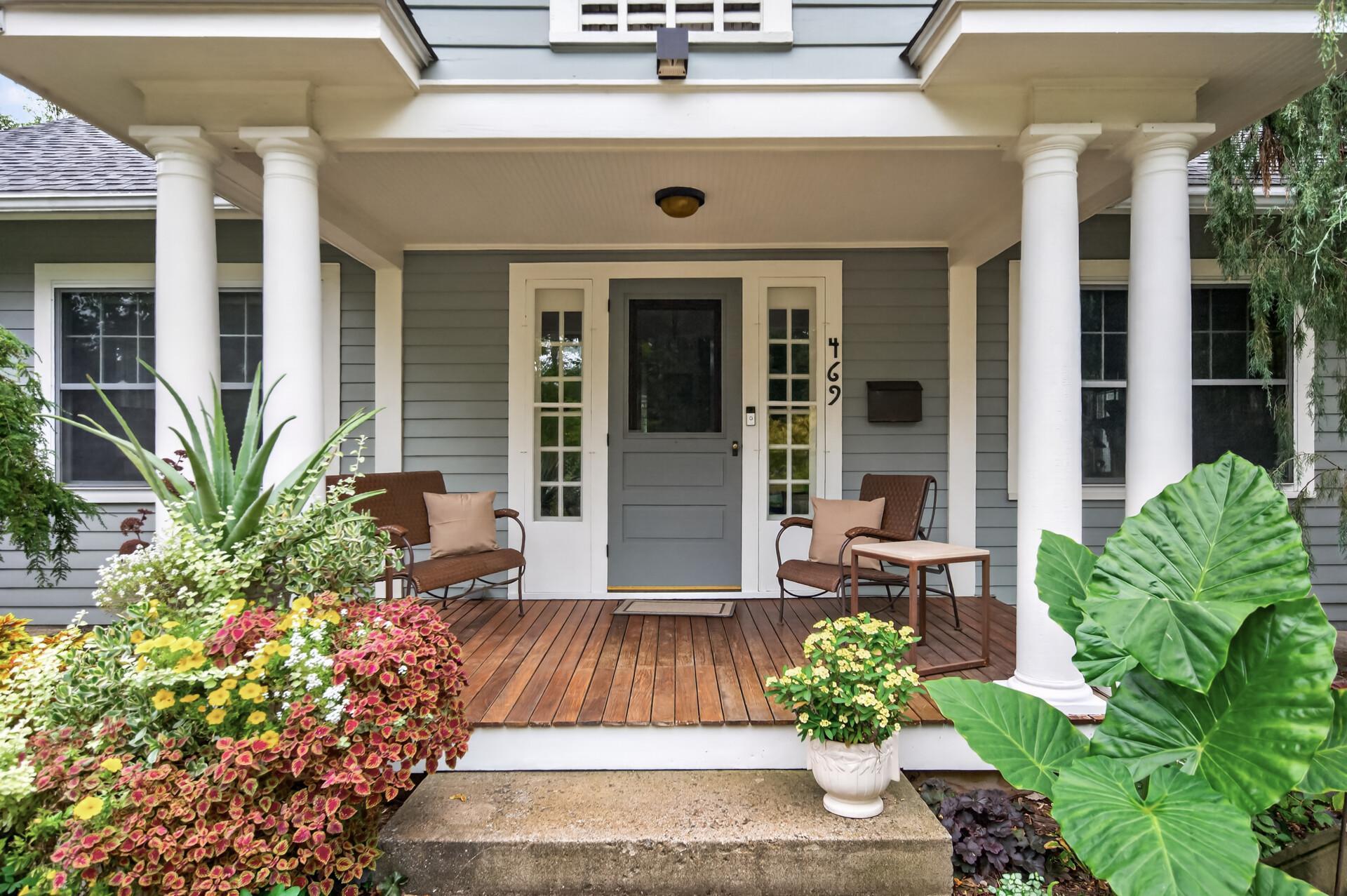 Warm and welcoming front entrance framed by the beautiful covered porch.