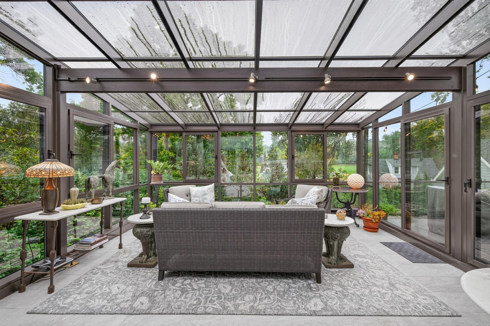 Spectacular four-season solarium surrounded by walls of windows.