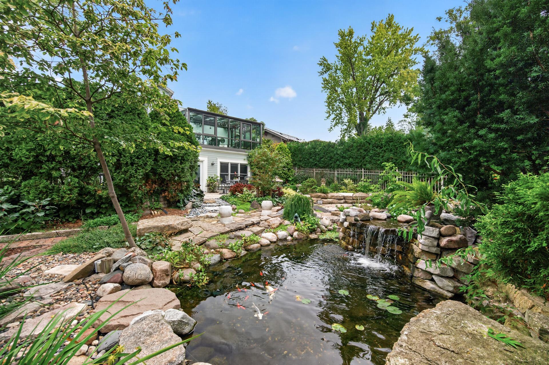 Ponds, waterfalls and mature plantings create a peaceful backyard retreat.