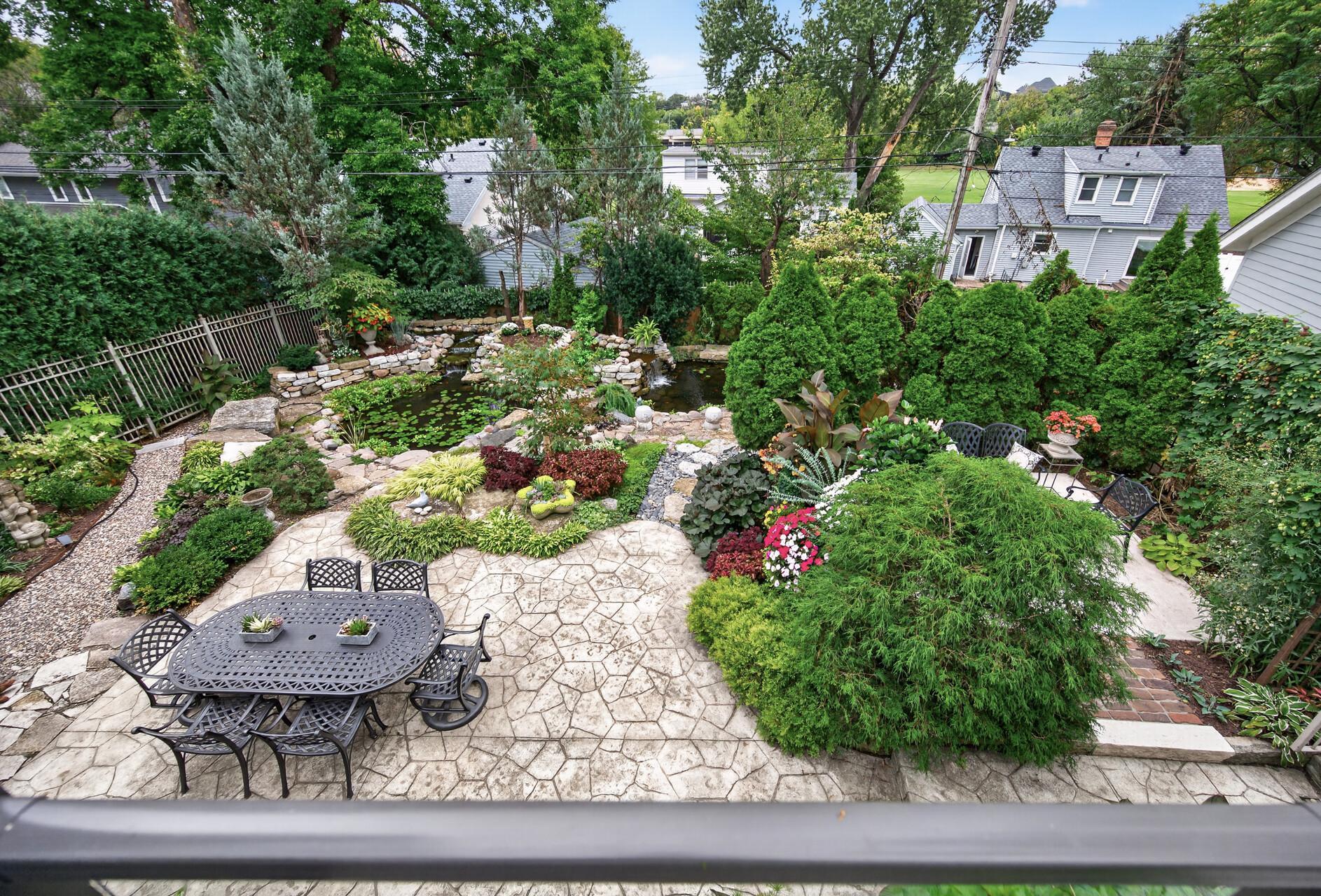 Beautiful views from the deck into the private backyard oasis.