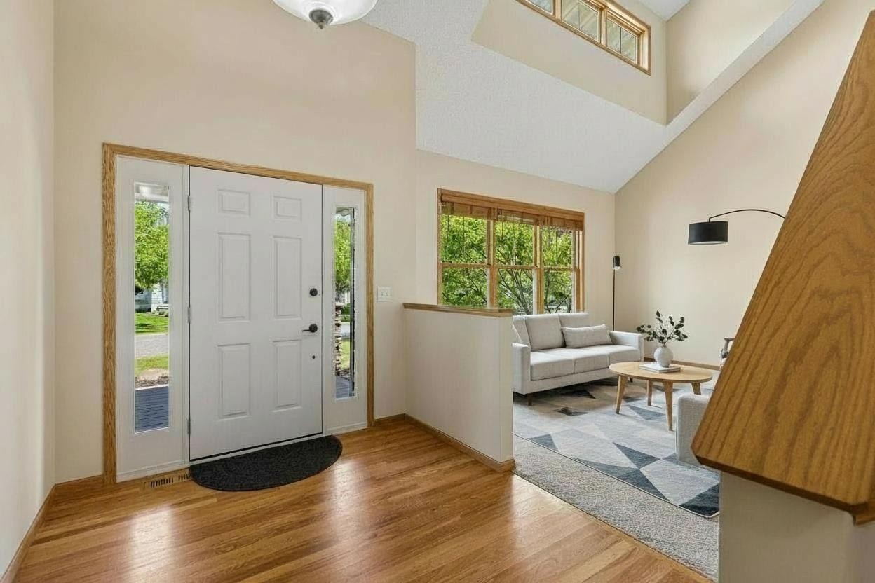 Virtually staged foyer with sitting room