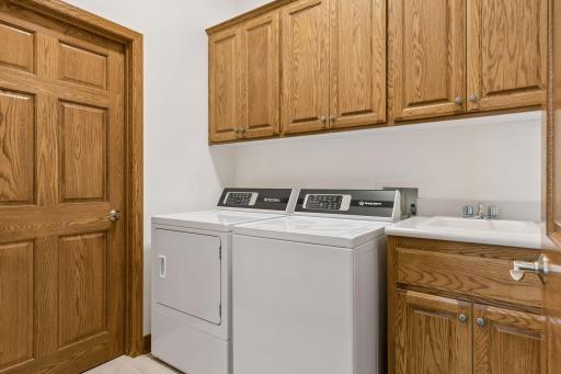 Your own private laundry room with great storage and utility sink