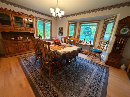 Formal dining room with bayed out window.