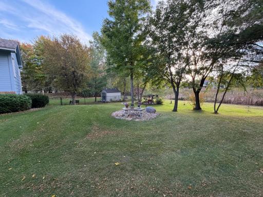 View of side yard, shed in back for storage.
