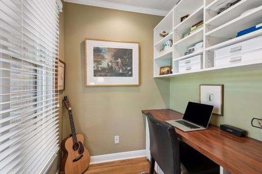 Office alcove with built in shelving and desk. Window faces the front.