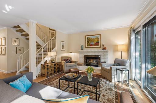 Beautiful hardwood floors and crown molding highlight the main floor. Room size allows options for furniture configuration and access to the beautiful patio and courtyard/commons space.