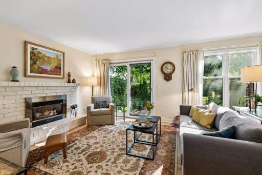 Pella windows and doors, gas fireplace, and a beautiful outdoor entertaining space. The views of greenery and trees are rare in a townhome setting.