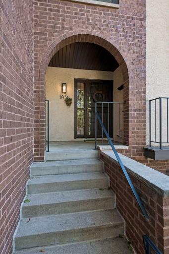 Welcome home to 1931 Emerson Avenue South! A covered entrance, charming arch.