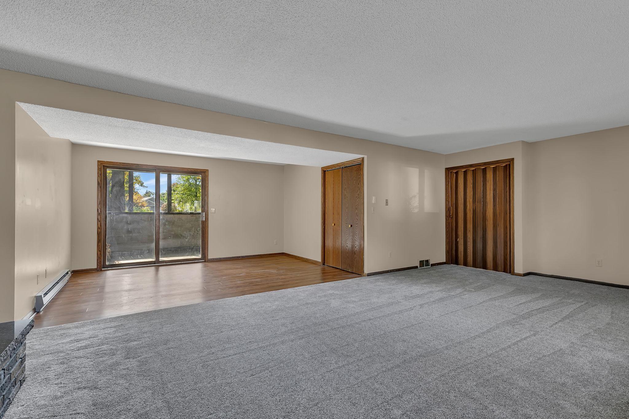 Bonus game space with wet bar leads to covered patio