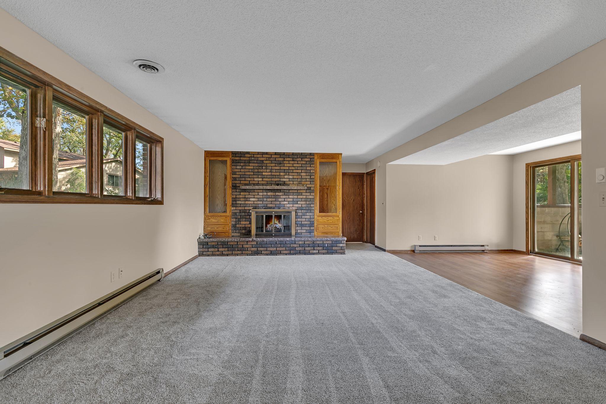 The lower level features an additional fireplace with built-ins